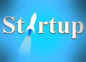 startup with a rocket graphic replacing the letter "a" against a blue background.
